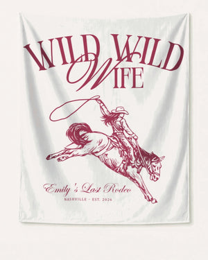 Gift idea for the bride: Wild Wild Wife bachelorette banner with vintage cowgirl illustration and script lettering. Personalized with bride name, destination city, and year for her last rodeo weekend.