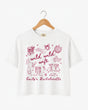 Boxy cropped bachelorette tee with playful doodle art and Wild Wild Wife script lettering for the bride and her crew. Personalize with bride name, date, and destination city.
