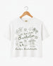 Bachelorette weekend crop tops with hand-drawn doodle script and playful icons for the Charleston bride crew. Personalized with bride name, destination city, and EST year for the full party.