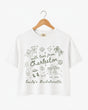 Bachelorette weekend crop tops with hand-drawn doodle script and playful icons for the Charleston bride crew. Personalized with bride name, destination city, and EST year for the full party.