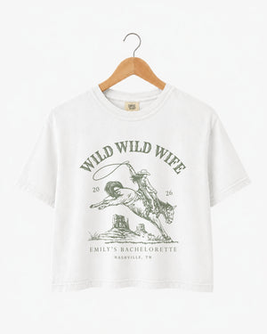 Bachelorette weekend crop top with vintage western rodeo theme for the Wild Wild Wife bride and her crew. Personalized with bride name, date, and destination city.