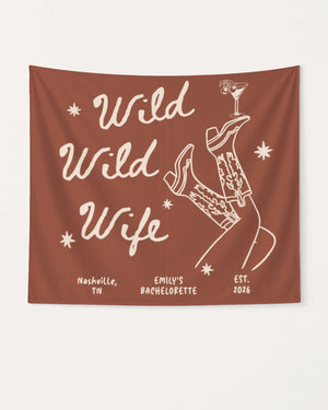 Bride and bridesmaids bachelorette party banner with Wild Wild Wife cowgirl martini line-art. Personalized with bride name, destination city, and year for the full crew celebration.