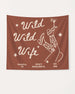 Bride and bridesmaids bachelorette party banner with Wild Wild Wife cowgirl martini line-art. Personalized with bride name, destination city, and year for the full crew celebration.