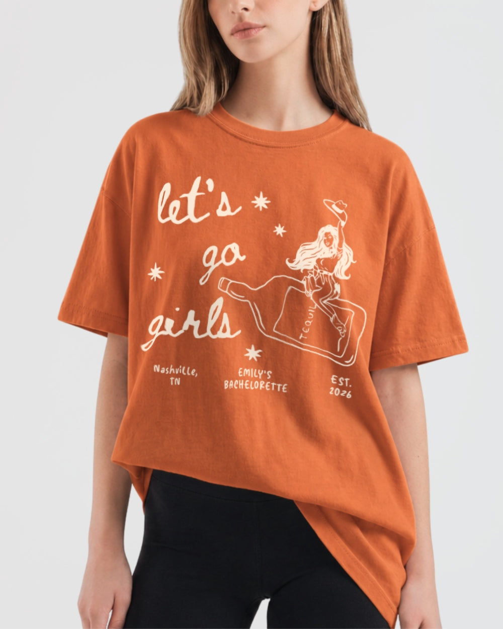 Gift idea for the girls night out crew: Let's Go Girls cowgirl bottle tee with minimalist vintage line-art. Fun pick for birthdays, bachelorette parties, or any casual girls trip.