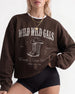 Pullover sweatshirt for the Wild Wild Wife bachelorette crew, country western theme with vintage cowboy boots graphic and varsity-style lettering. Bride name, year, and destination customizable.