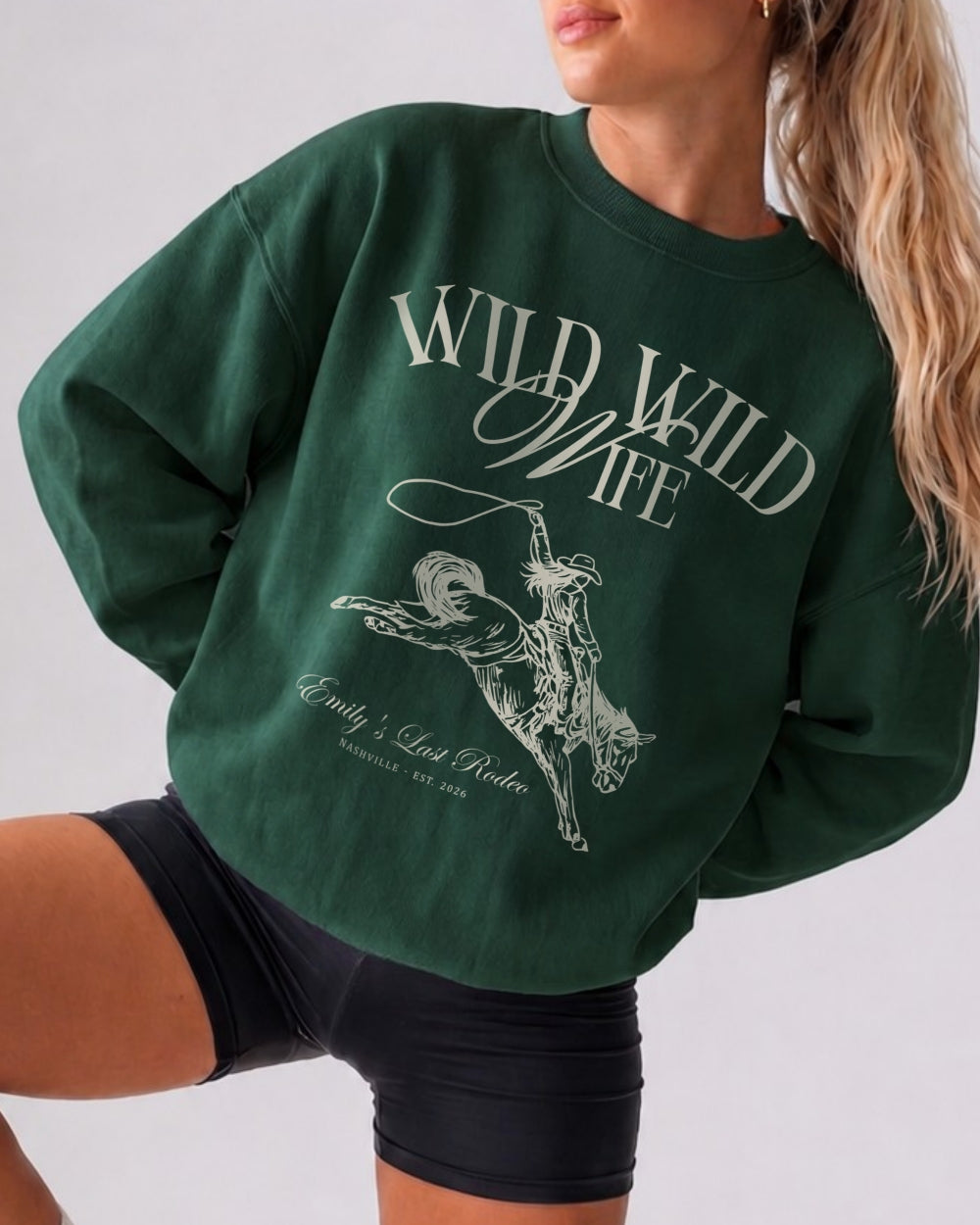 Boxy crewneck sweatshirt with vintage western illustration for a country bride bachelorette. Customizable with destination, date, and bride name for the whole Wild Wild Wife crew.
