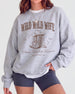 Bride and bridesmaids matching country western sweatshirts for a Wild Wild Wife bachelorette crew. Varsity-style lettering with vintage cowboy boots graphic, perfect for a Nashville girls weekend.