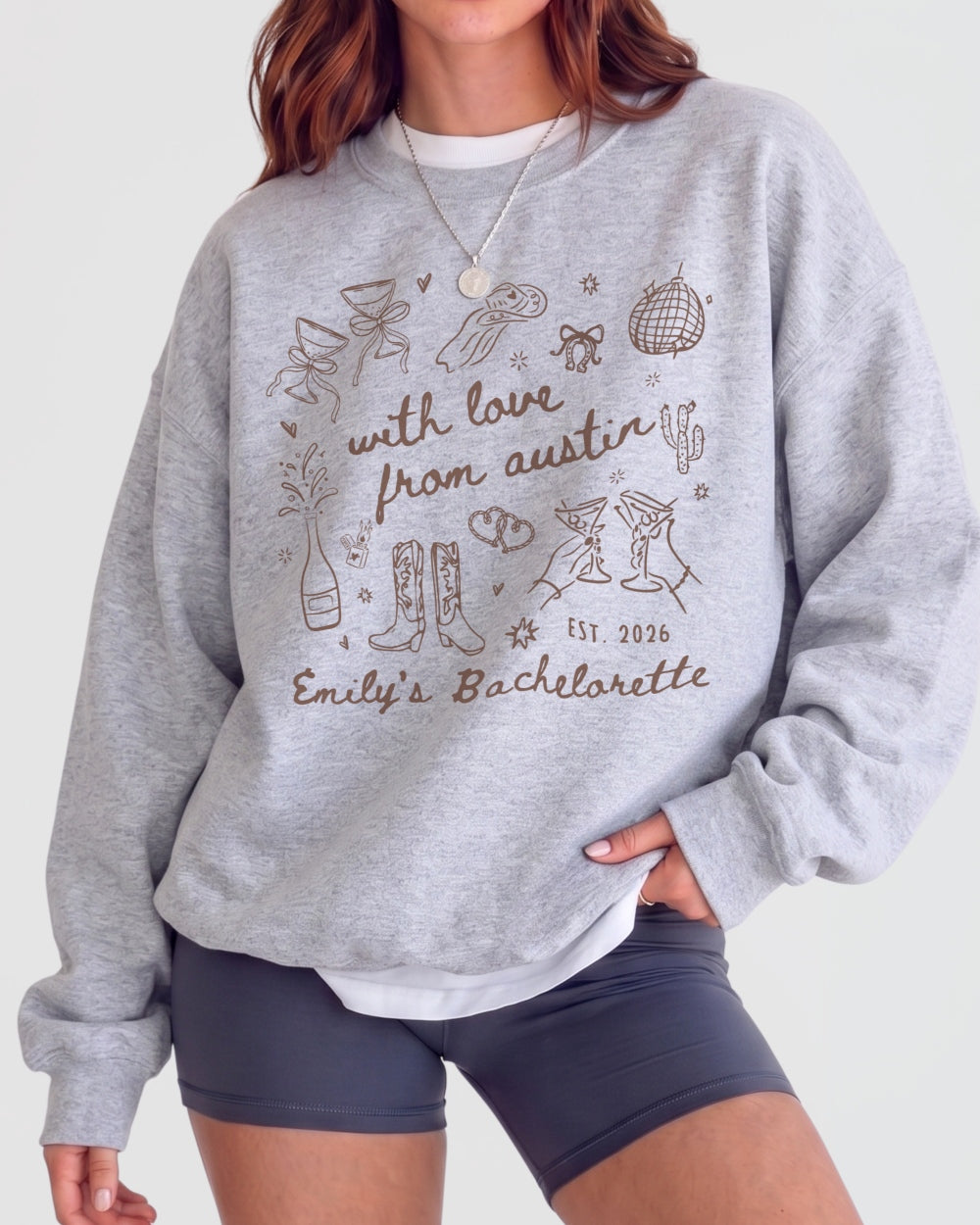 Bridesmaid gift idea: Austin bachelorette sweatshirt with soft doodle art and script lettering. Personalized with bride name, destination city, and weekend date for the whole crew.